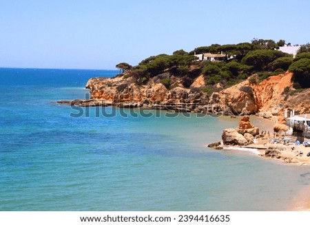 View of the sea and rocks of the beach of Olhos de Agua, Albufeira, Algarve, Portugal.