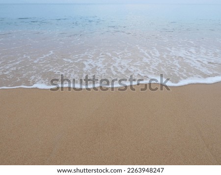 view of sea waves that blow on the shore, soft wave on the sand beach