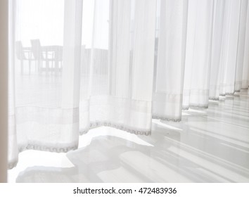 view seascape looking pass Translucent white fabric curtains and outdoor  terrace, pattaya city, thailand - Powered by Shutterstock