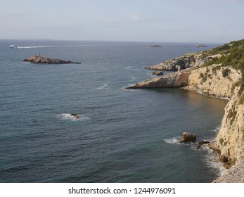 View of seashore with cliffs and sky