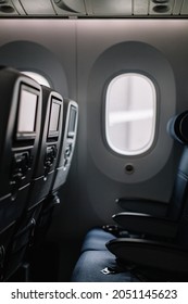 View Of The Seats And Window Inside The Airplane