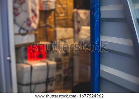 View of self storage warehouse, process of keeping and storing the goods and items in storage units, self-storage building, lock and key concept