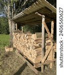 A view of a self-made firewood ridge being filled with log