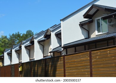 A View Of A Semi Detached House, Duplex Apartments, 6 Unit Multi-plex House Behind The Fence.  