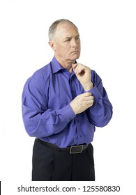 View Of A Senior Man Getting Dressed For Office.