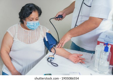 View Of A Senior Woman's Blood Pressure Check