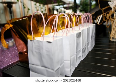 A view of several goodie bags on a table, seen at a reception event. - Shutterstock ID 2025026168