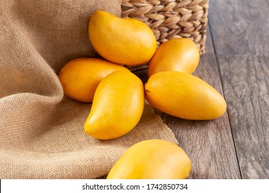 A View Of Several Honey Mangoes, In A Still Life Setting.