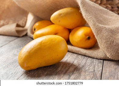 A View Of Several Honey Mangoes, In A Still Life Setting.