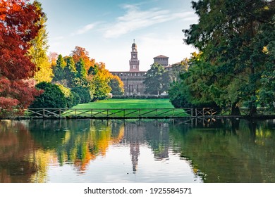View of the Sforza Castle from Sempione Park (Milan - Italy) in an autumn day with a small lake in the foreground - Shutterstock ID 1925584571
