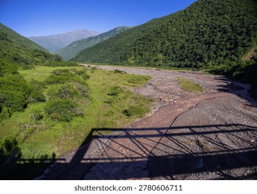 View of the shadow of the Mal Paso Bridge (Spanish: Puente Mal Paso) on the Escoipe River in Salta, Argentina