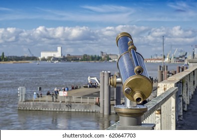 View of the Shelda River from the viewing platform of the wharf of Antwerp. Telescope with landscape