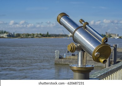 View of the Shelda River from the viewing platform of the wharf of Antwerp. Telescope with landscape