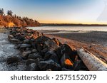 A view of the shoreline at sunset at a park in Des Moines, Washington.