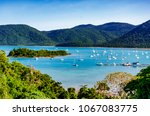 View of Shute Harbour, islands and Conway National Park, from the mainland at Shute Haven, The Whitsundays, Queensland, Australia.  Yachts moored. Tropical climate. The Tropics. Copy space. 