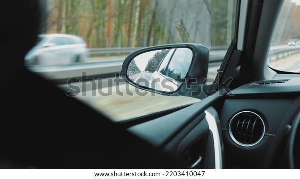 View from Side\
Window of Car Driving on\
Highway
