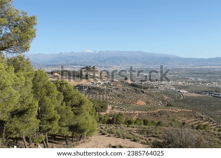 
view of the Sierra Nevada from the nearby Sierra de Elvira
