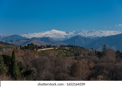 View To Sierra Nevada Snowy Mountains During Sunny Winter Day. Granada, Europe, Spain