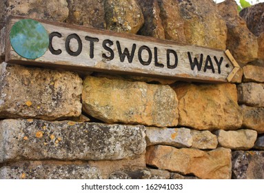 A view of a signpost pointing the way to get to the Cotswolds  / This way to the Cotswolds