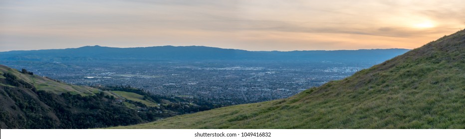 View of the Silicon Valley and Downtown San Jose In Between Large Moauntins at Sunset