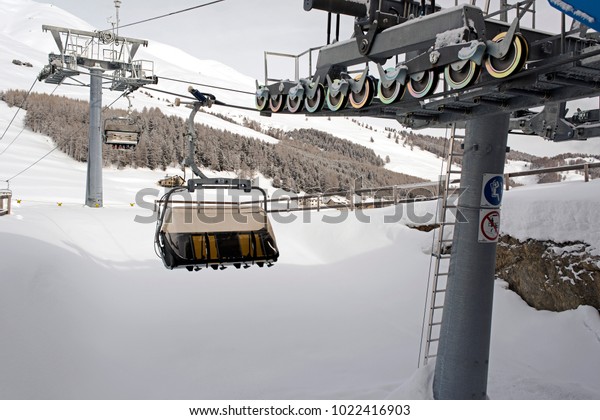 A view of ski lift and cable car in the alps\
switzerland in winter