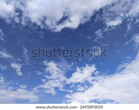 The view of the sky with cloud formations looks varied, from fine clumps to denser and layered forms.