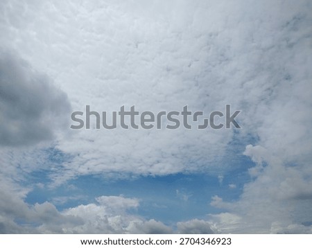 view of the sky with clouds during the dazzling day