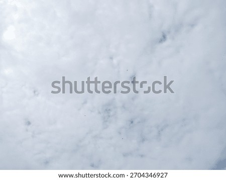 view of the sky with clouds during the dazzling day