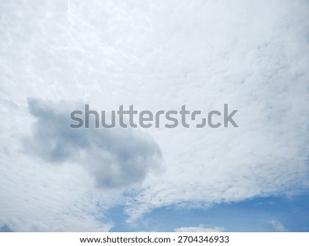 view of the sky with clouds during the dazzling day