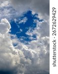 A view of sky in the middle of dense clouds. Cloudscape background.