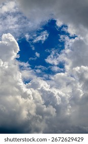 A view of sky in the middle of dense clouds. Cloudscape background.