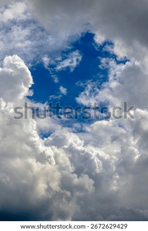 A view of sky in the middle of dense clouds. Cloudscape background.