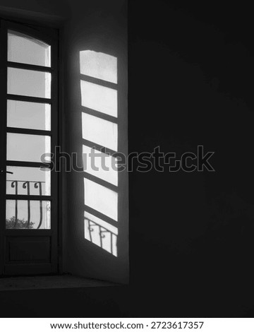 View of the sky though a window with light shining in