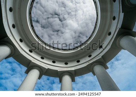 View of the sky through the cutout in the ceiling of the gazebo.