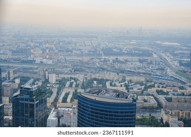 View from a skyscraper to Moscow. From the height of the skyscraper, you feel the grandeur of the metropolis. Moscow's streets are lined with skyscrapers and historic buildings - Shutterstock ID 2367111591