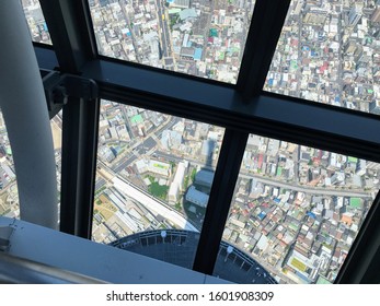 View from the skyscraper observation deck looking down on the ground.