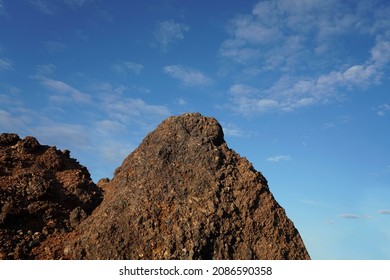 View of slag heaps of iron ore quarry. Mining industry. Slag Coal Burnt out, Texture heap top view. Nature rock Red Background spent coal.
