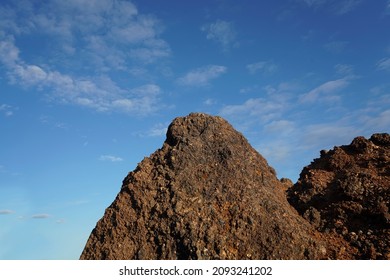 View Of Slag Heaps Of Iron Ore Quarry. Mining Industry. Slag Coal Burnt Out, Texture Heap Top View. Nature Rock Red Background Spent Coal.