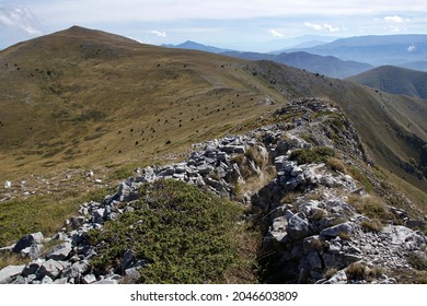 View from Slavyanka mountain to hilss in Greece with sky and peaks. The border between Bulgaria and Greece.
