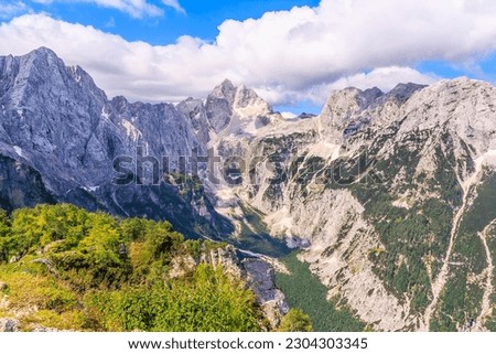 View from Slemenova špica (1911 m) in the Julian Alps (Slovenia) to the rock wall of the surrounding peaks. On the left one of the peaks of Mojstrovka, in the middle - Jalovec (2643 m).