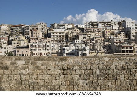 View to the slums with the walls of Citadel of Raymond de Saint-Gilles with cloud, Tripoli, Lebanon
