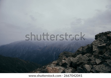 “Panoramic View of the Small Almaty Ring Trail with Chimbulachka, Bashuta, Panarama and Furmanovka Peaks”