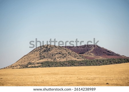 View of a small extinct cinder cone volcano south of Capulin Volcano National Monument in the Raton-Clayton Volcanic Field. (Photo by Gunnar Rathbun)