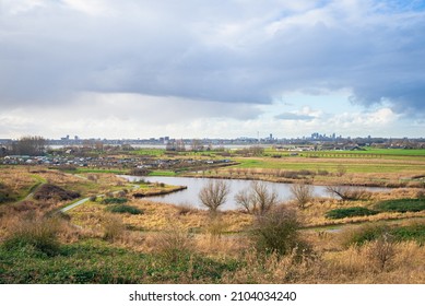 View from a small hill in recreation park "Buytenpark" in Zoetermeer, Netherlands. On the horizon The Hague skyline can be seen.