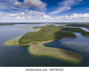 View Of Small Islands On The Lake In Masuria And Podlasie District, Poland.
Blue Water And Whites Clouds. Summer Time. View From Above.