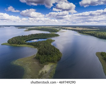 View Of Small Islands On The Lake In Masuria And Podlasie District, Poland.
Blue Water And Whites Clouds. Summer Time. View From Above.