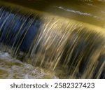 View of a small murky waterfall in slow shutterspeed. 