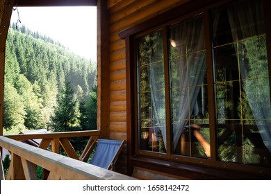 View of small porch with wooden staircase bridge, siding house exterior.Big house wooden in village with beautiful sky and has good weather.Wooden terrace of wooden house. - Powered by Shutterstock