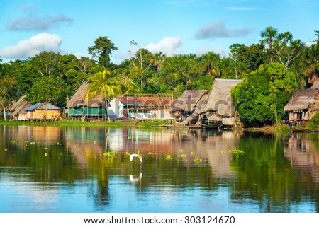 View of a small village in the Amazon rain forest on the shore of the Yanayacu River in Peru