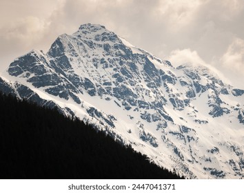 View of the Snow Covered Mountain Peaks and Forest at North Cascades National Park in Washington State, USA - Powered by Shutterstock
